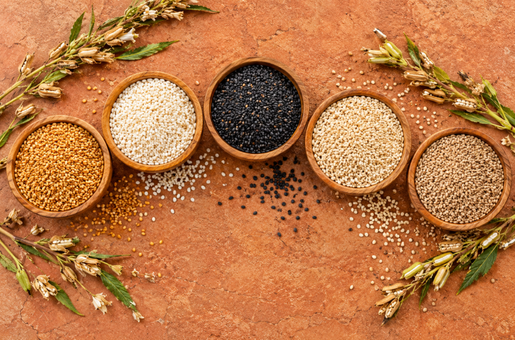 Five sesame seed varieties in wooden bowls, Allahmdolillah Exports